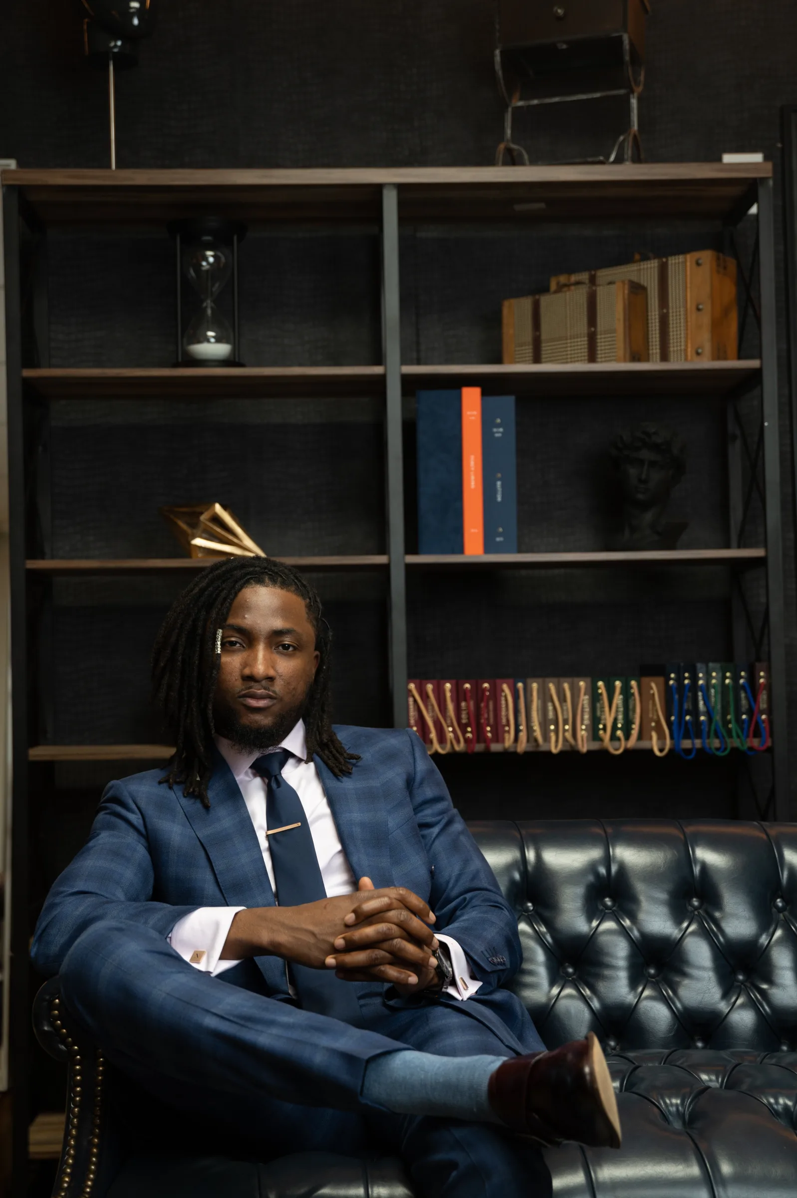 A chief executive in a bespoke navy double-breasted suit