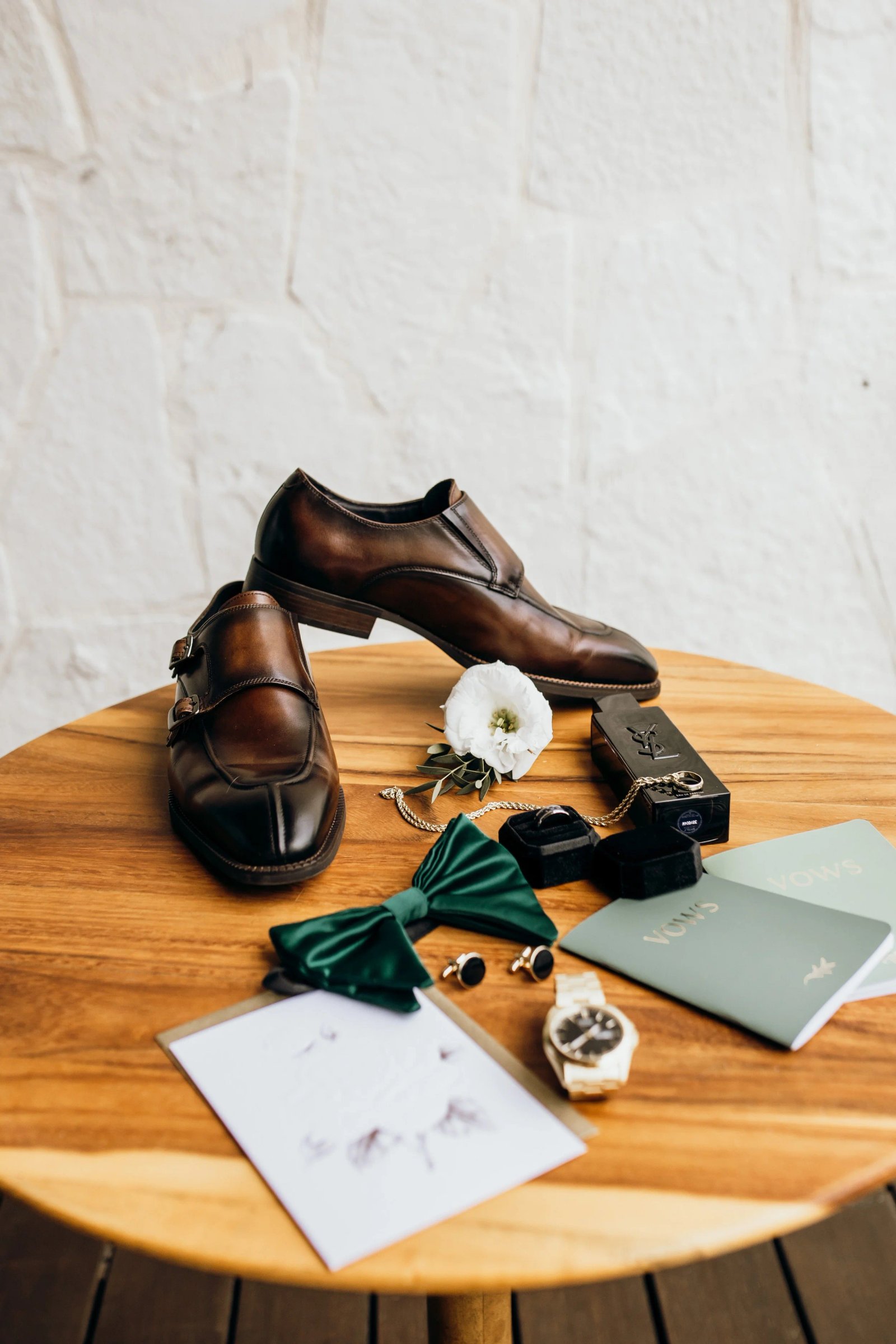 Flat-lay of the groom's wedding details